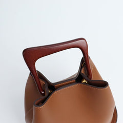 IT Ozzy Bag | Modern Chic Leather Shoulder Bucket Bag with Amber Acrylic Handles