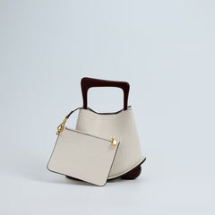 IT Ozzy Bag | Modern Chic Leather Shoulder Bucket Bag with Amber Acrylic Handles