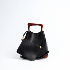 IT Ozzy Bag | Modern Chic Leather Shoulder Bucket Bag with Amber Acrylic Handles