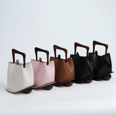 IT Ozzy Bag | Modern Chic Leather Shoulder Bucket Bag with Amber Acrylic Handles